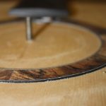 It is glued in oversize and will be left overnight before sanding flush