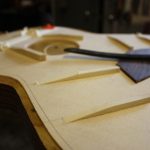 The finger braces are carved from full height in the middle down to nothing at the ends