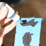 Black superglue fills the hole