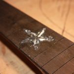 The inlay is fixed in permanently with black superglue