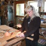 The inlay must be sanded flush to the fretboard surface