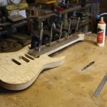 gluing on the ebony fretboard