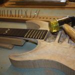 the frets are hammered in