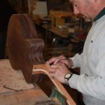 Sanding the neck body join area