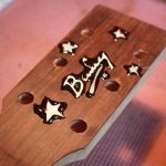 The inlays are glued with a paste made from epoxy and wood dust
