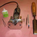 Super glue and tweezers, mini router and cutters, scribe and scalpel, and a large chisel for prising off the peices