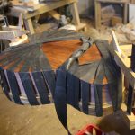 sealing the body of the guitar by gluing the back on