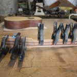The fillet is glued over the truss rod to hold it in place. Also wings are glued on to make the headstock wide enough