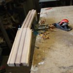 The extra pieces are planed level to the face of the headstock