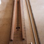 The neck sits between two rails to help keep it in place
