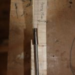 The depth is carefully marked so the nut comes out above the surface of the headstock, but not too close to the top of the fretboard