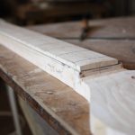 The curve (bottom of the truss rod slot) is drawn on the side of the neck and extended to show where it will emerge.